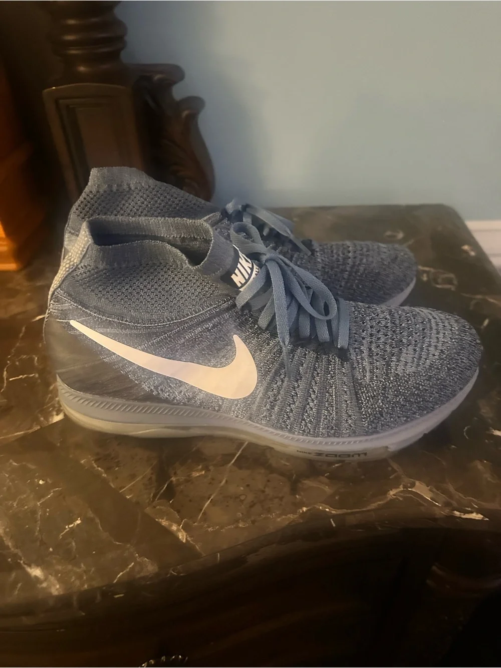 Nike Men’s Blue Flyknit Mid-Top Sneakers with White Swoosh